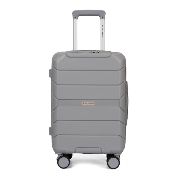 Front side view of a grey hard side luggage called Altitude designed by Air Canada sold at Bentley, showcasing its telescopic handle and resistant shell texture.