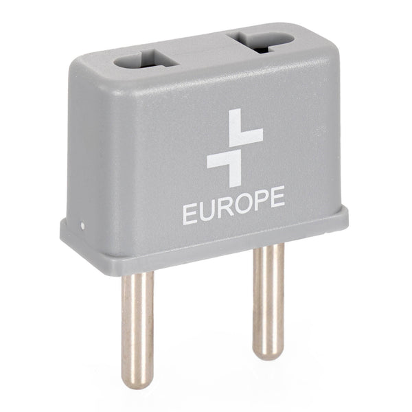 Travel plug extension in grey with the tracker logo and the word "europe" printed on it. Two prongs facing downwards and extension part facing the top.