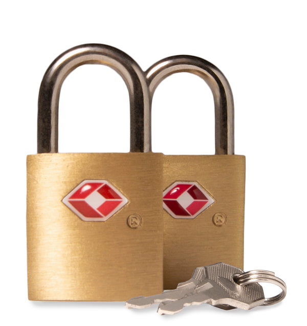 2 bronze-coloured locks and 2 silver metallic keys designed by tracker showing the TSA logo and brushed metal texture.