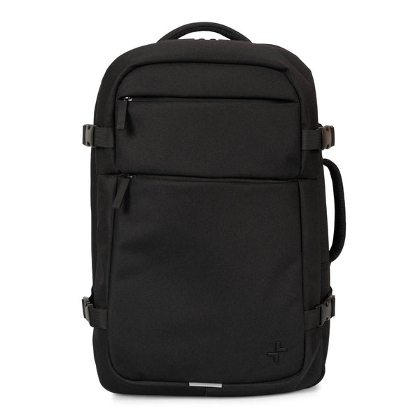 Front side of a black backpack called West Bay 3.0 Convertible designed by Tracker showing its 2 front pockets, top handle, side clips, and side handle.