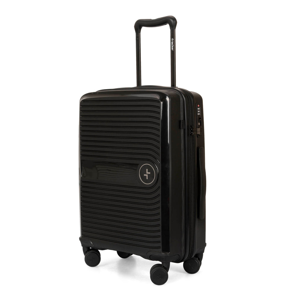 Angle view of a black luggage called Dynamo designed by Tracker showing its telescopic handle, lined-pattern shell, spinner wheels and tracker symbol embossed on the front.