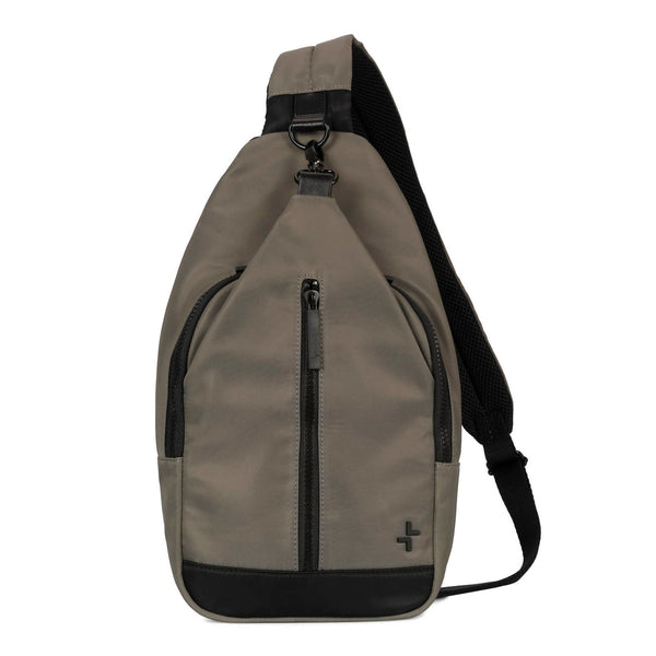 Front side of a grey-green sling bag called suttong designed by Tracker on a white background, showcasing its from zipper pocket and strap.
